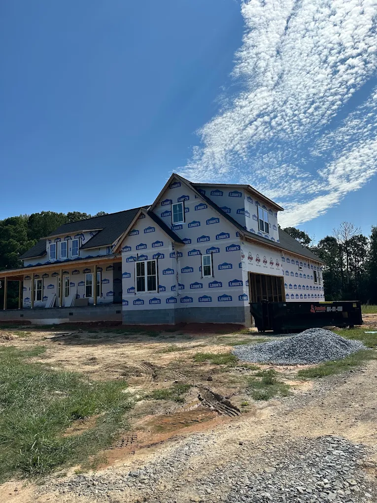 Proudfoot roll-off dumpster at a new home build in the Greenwood area