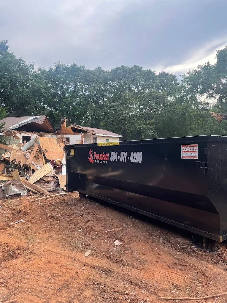 Proudfoot Rolloffs dumpster loaded during a structure teardown near Greenwood, SC